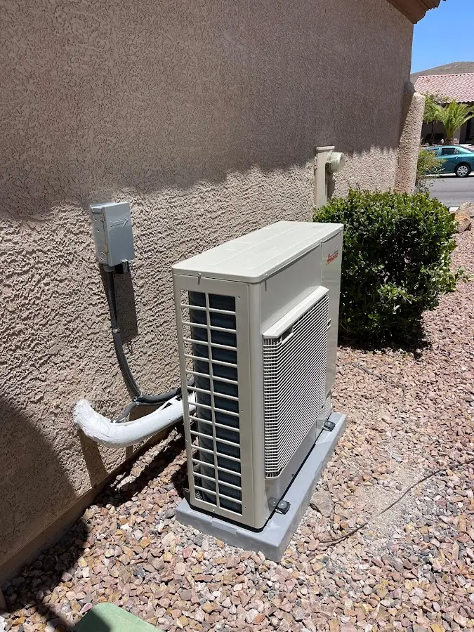 Residential air conditioning condenser unit in Alden